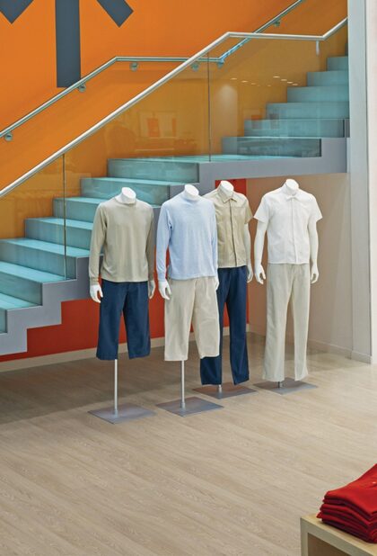 Acoustix Forest fx PUR acoustic vinyl flooring in a pale oak plank design in a retail interior