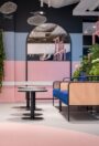 Palettone PUR homogeneous vinyl flooring in coral pink in a cafe seating area