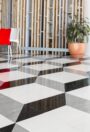 Standard XL PU homogeneous vinyl flooring in a black and white geometric pattern in a foyer