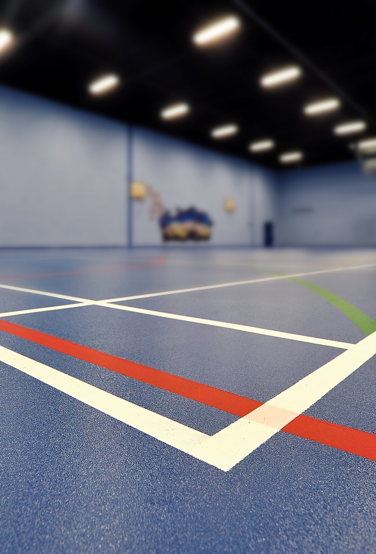 Sport 67 sports vinyl flooring with court markings in an indoor sports hall